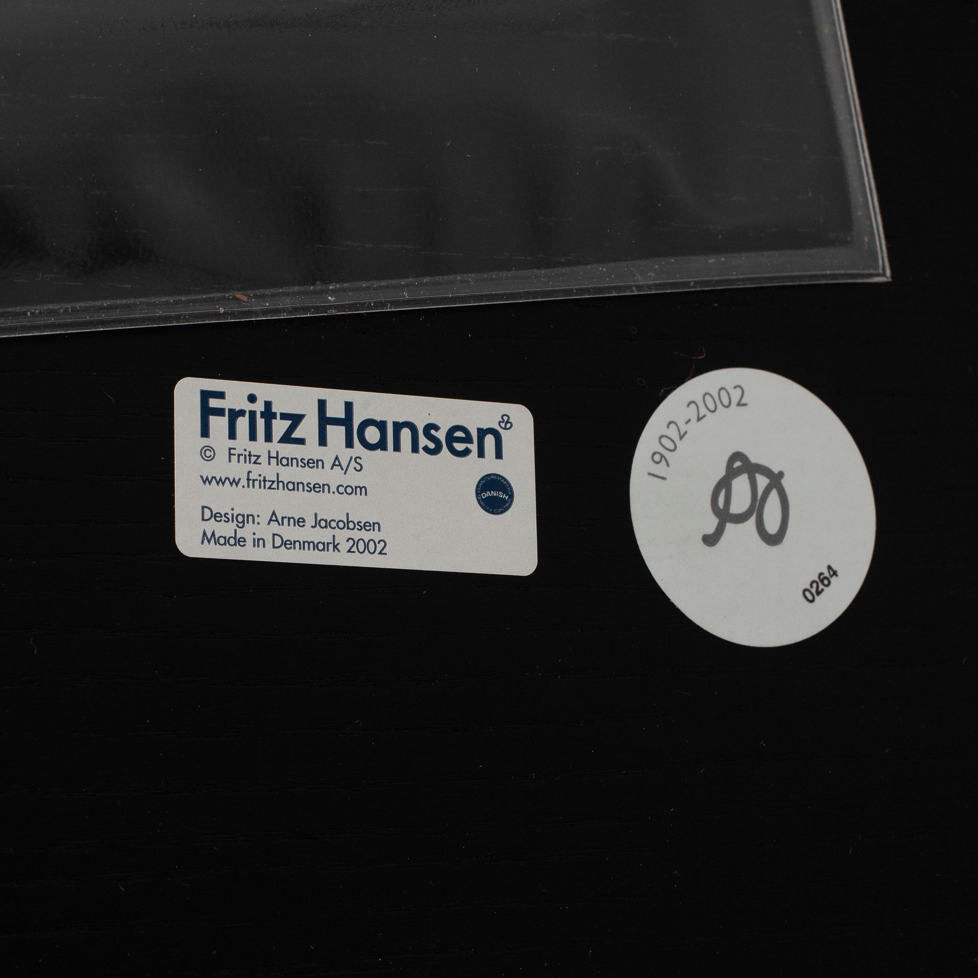 An Arne Jacobsen "Centenary Package" comprising three "Ant Chairs" and an eggshaped table, Fritz Hansen, Denmark.