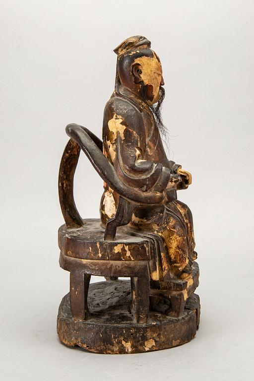 A Chinese late Qing painted wooden sculpture.