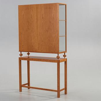 Josef Frank, a cherry showcase cabinet, Svenskt Tenn, model 2077, post 1985.