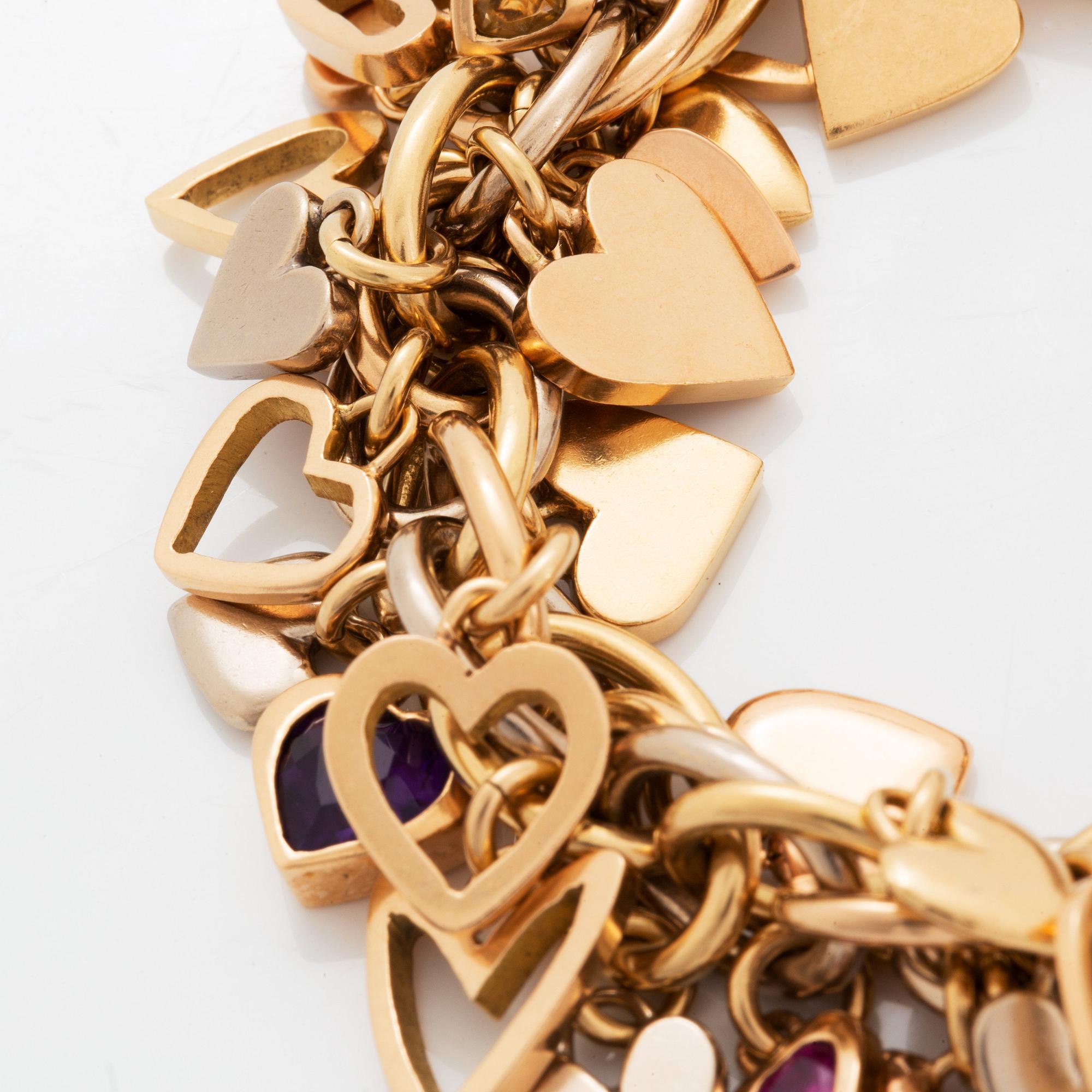 An 18K gold Gaudy bracelet with heart shaped charms.