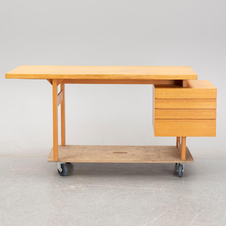 A pine writing desk by Olavi Hänninen for Nupponen, second half of the 20th Century.