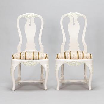 A pair of Rococo style armchairs, a pair of chairs, and a table, mid 20th century.