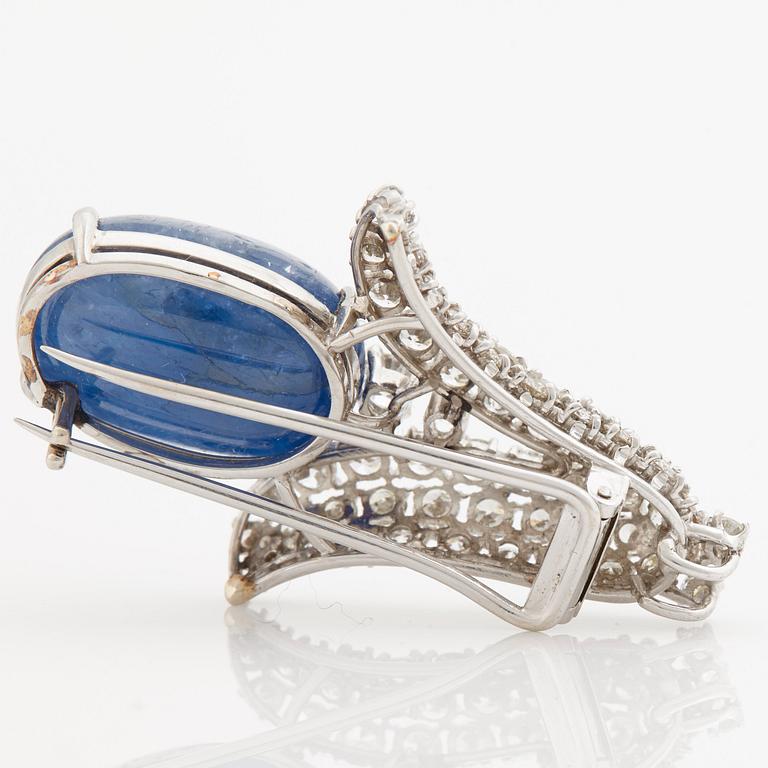 A cabochon cut Ceylon sapphire and brilliant cut diamond pendant/brooch.