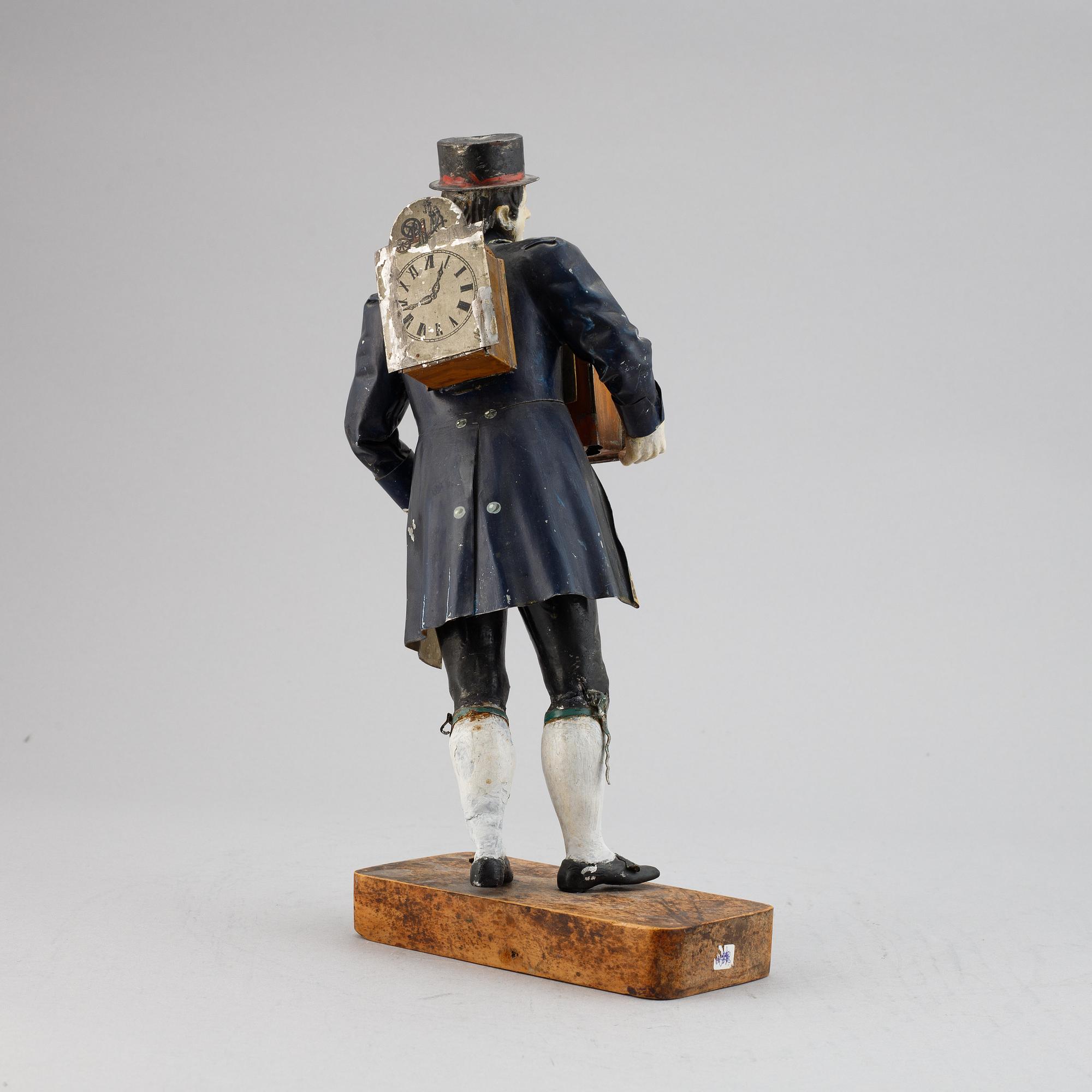 A Black Forest sheet metal figural timepiece, second half of the 19th century.
