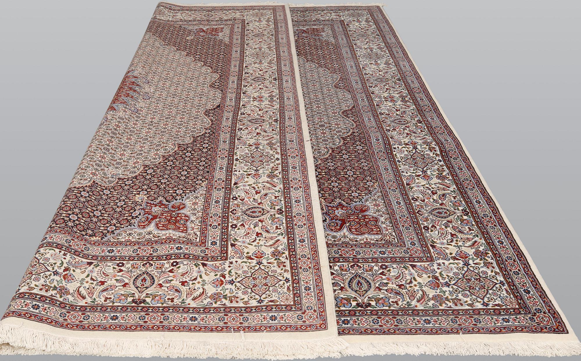 A part silk Moud carpet, approximately 350 x 252 cm.