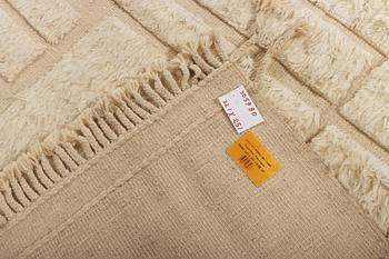 A relief-cut Moroccan carpet, c. 321 x 251 cm.