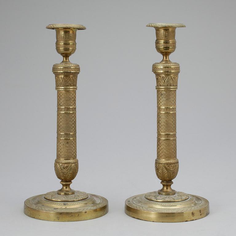 LJUSSTAKAR, ett par, brons. Empirestil 1800-tal.