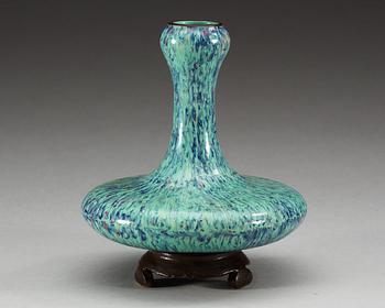 A rare porcelain vase on stand, Qing dynasty.