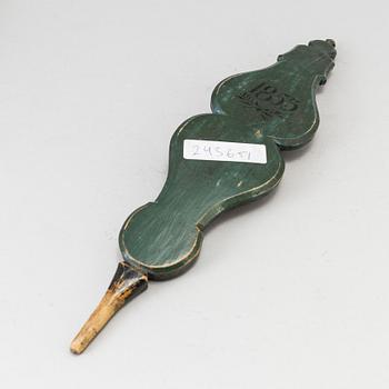 Two painted folk art flax ornaments dated 1817 and 1853.