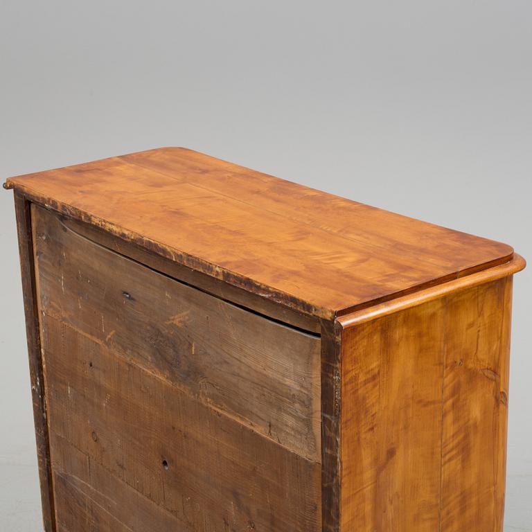 A second half of the 19th century birch veneered chest of drawer.