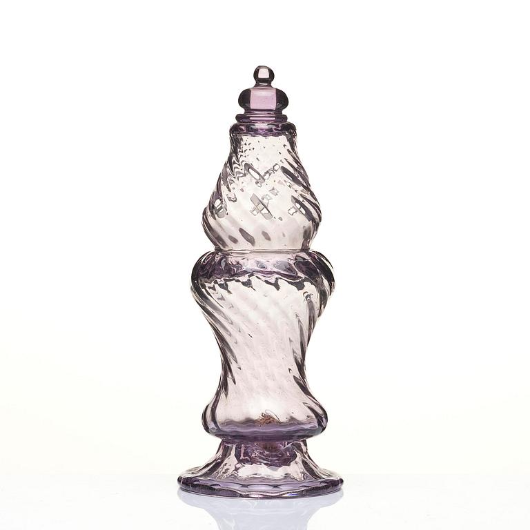 An amethyst coloured suger shaker and a cut glass goblet, 18th century.