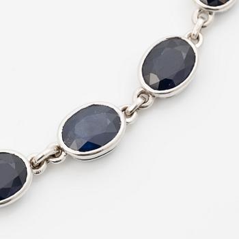 18K white gold necklace with dark sapphires.