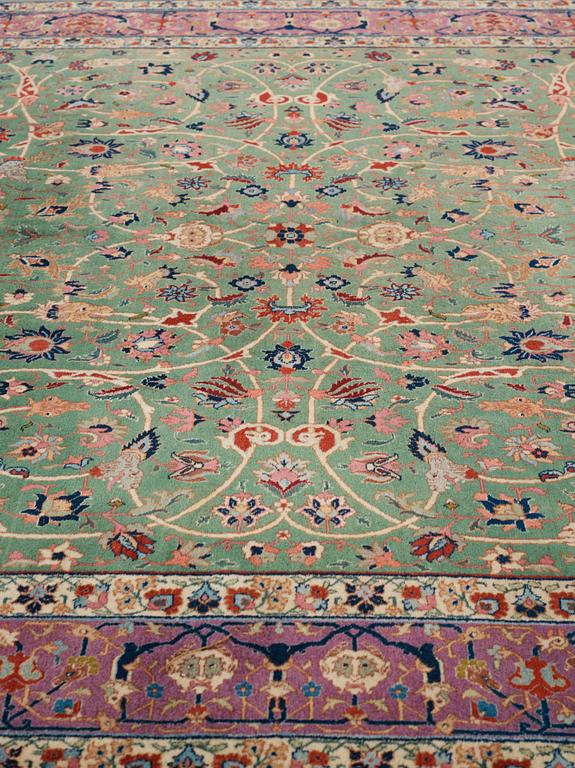 A carpet, a semi-antique Tabriz, ca 374-376,5 x 268-276 cm.