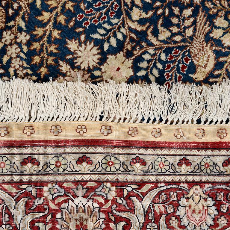 An oriental silk rug, c. 155 x 95 cm.
