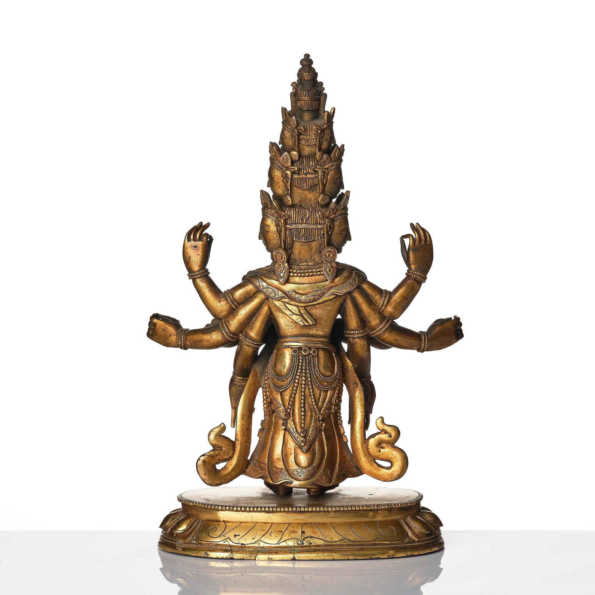 A Tibeto-Chinese gilt bronze figure of Avalokiteshvara Ekasdashamukra, 19th century.