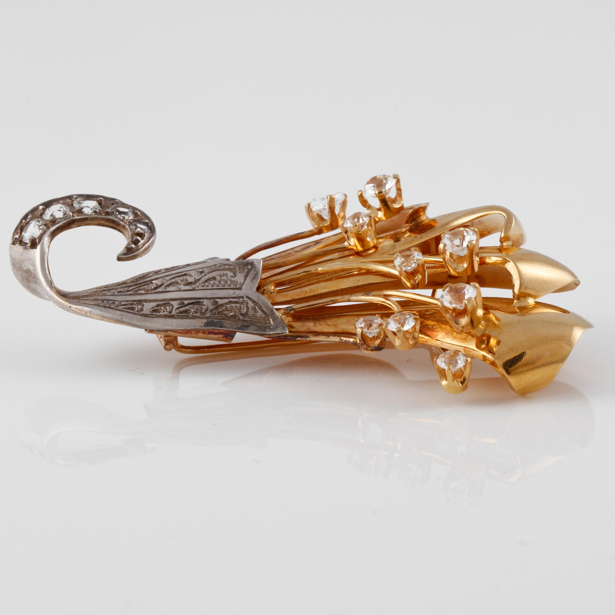 BROSCH, 18K guld samt silver med fasettslipade vita stenar, Wilhelm Harbeck, Stockholm, 1948. Vikt 15,5 gram.