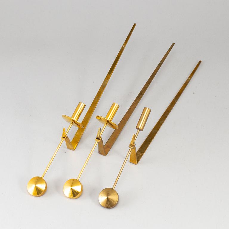 Three(2+1) brass wall sconces by Pierre Forsell, "Pendeln", Skultuna.