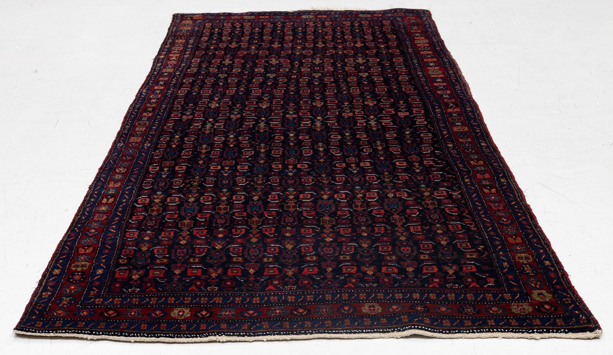A semi-antique Bidjar carpet, c. 310 x 145 cm.