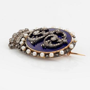 A Royal monogram/a brooch.
