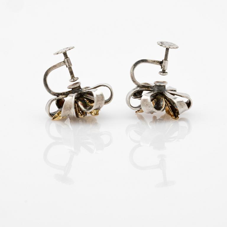 Earrings, a pair, silver and 14k gold with brilliant-cut diamond.