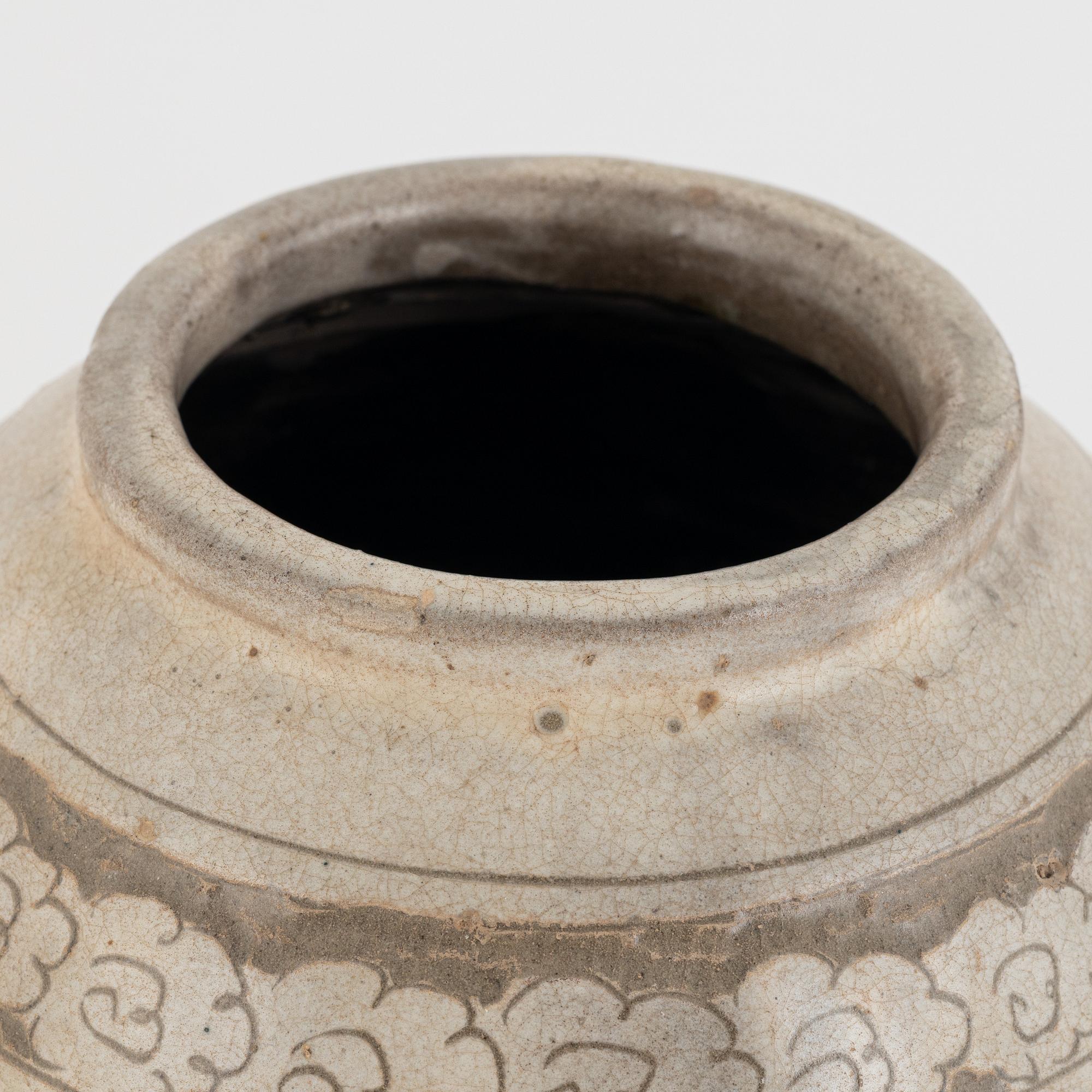 A Chinese glazed stoneware jar, probably Ming dynasty (1368–1644).