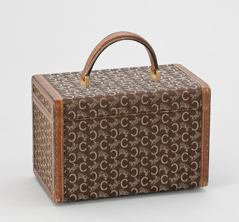 A monogram canvas beautybox by Celine.