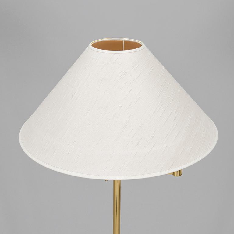 A 1970s/80s brass floor lamp, wall lamp and table lamp.