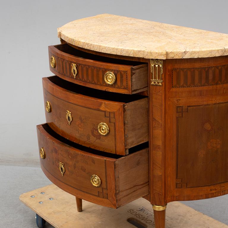 A Louis XVI-style 20th century commode.