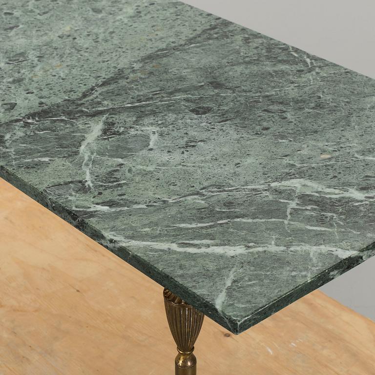 A MARBLE TOP COFFEE TABLE.