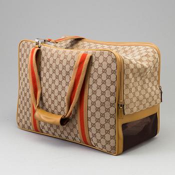 GUCCI, a monogram canvas dog bag.