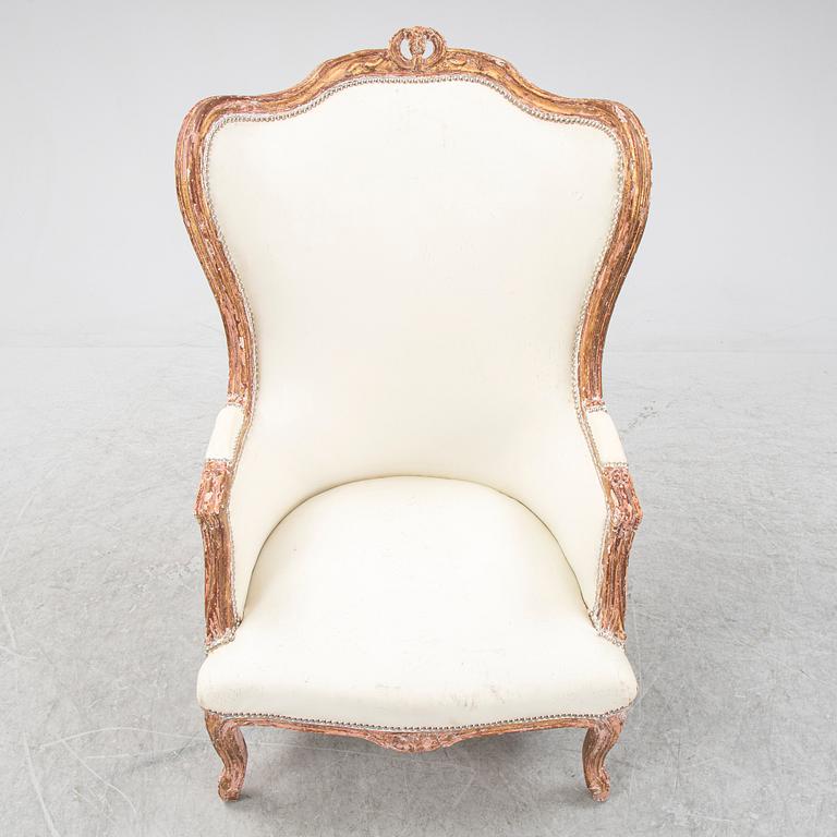 A gilt Louis XV style bergère, first half of the 20th Century.