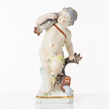 A porcelain figure of a putto carrying a fish, 19th century.