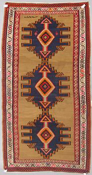 A persian kilim, around 312 x 170 cm.