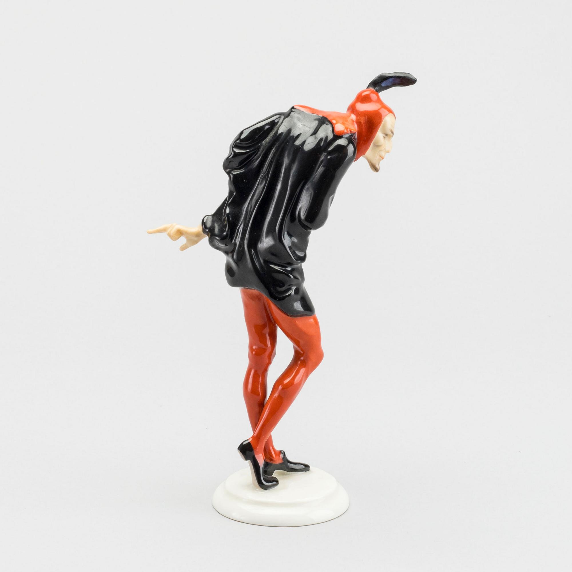 KARL TUTTER,  a signed porcelain figurine.