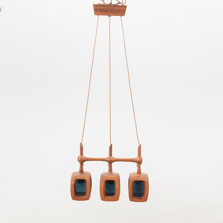 A 1960s teak ceiling pendant from Stilarmatur Tranås.