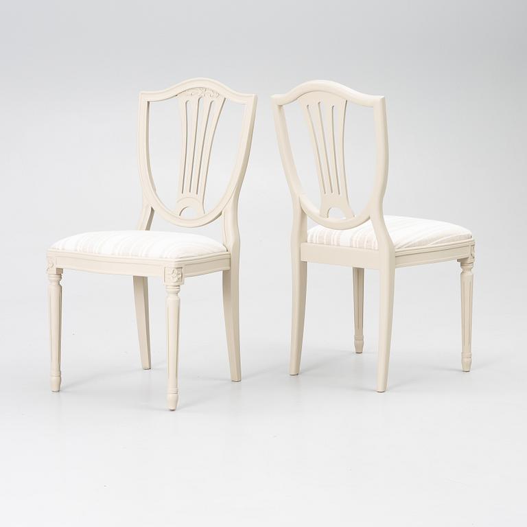 A dining table with 10 chairs, Gustavian Style dining suite, second half of the 20th century.