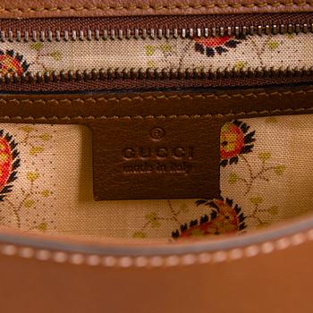 Gucci, a 'GG Marmont' leather bag.