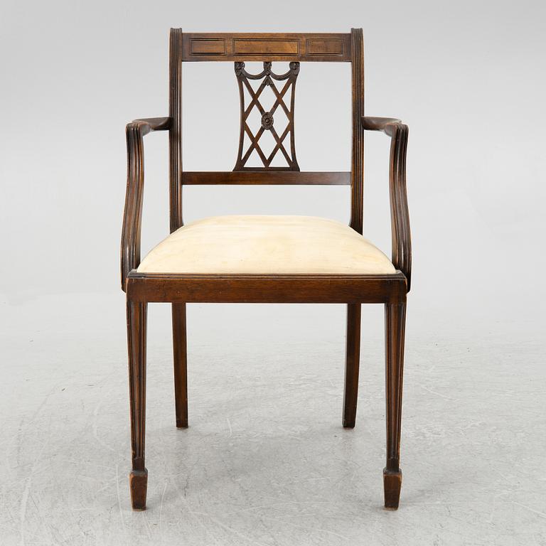 A mahogany and mahogany veneer desk with desk chair, 20th Century.