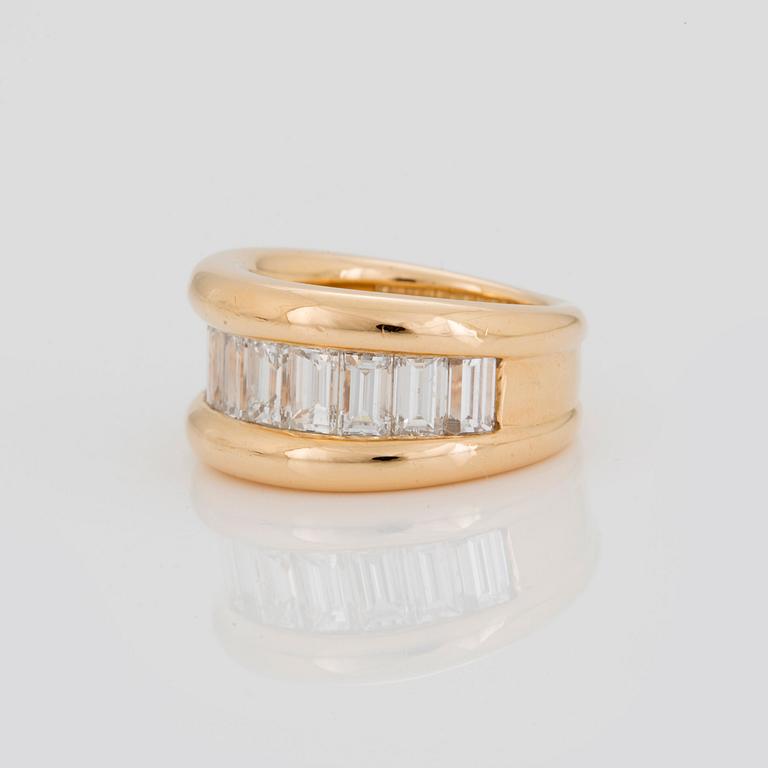 A HALF-ETERNITY RING set with baguette-cut diamonds.