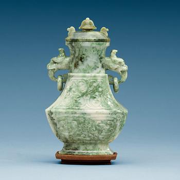 1624. A Chinese archaistic green stone vase with cover, 20th Century.