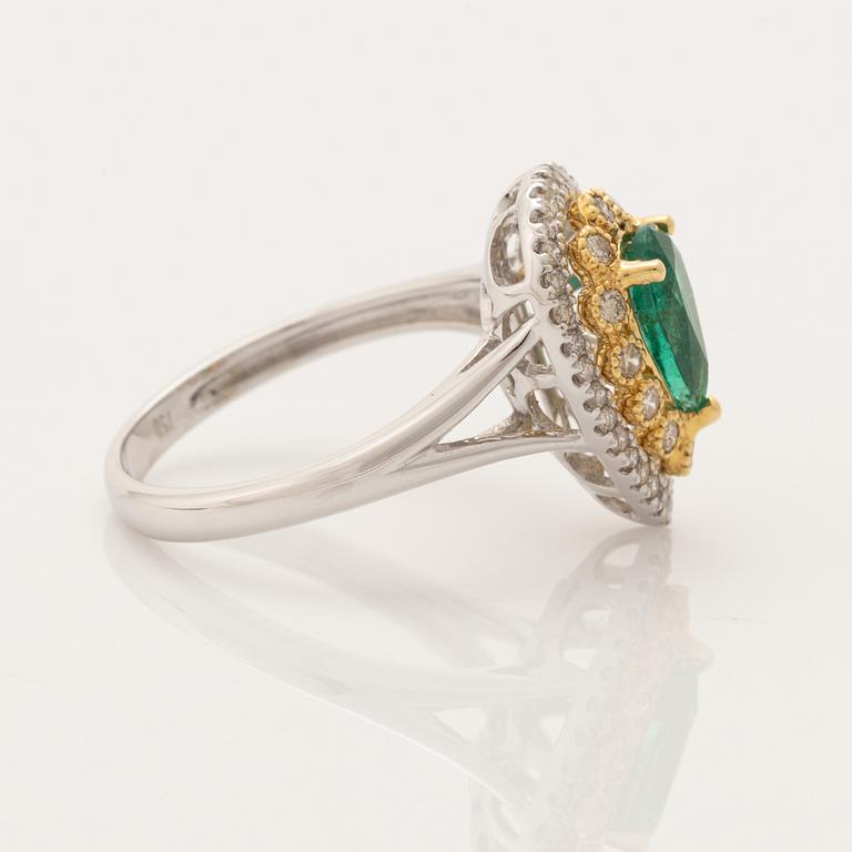 Pear shaped emerald and brilliant cut diamond ring.