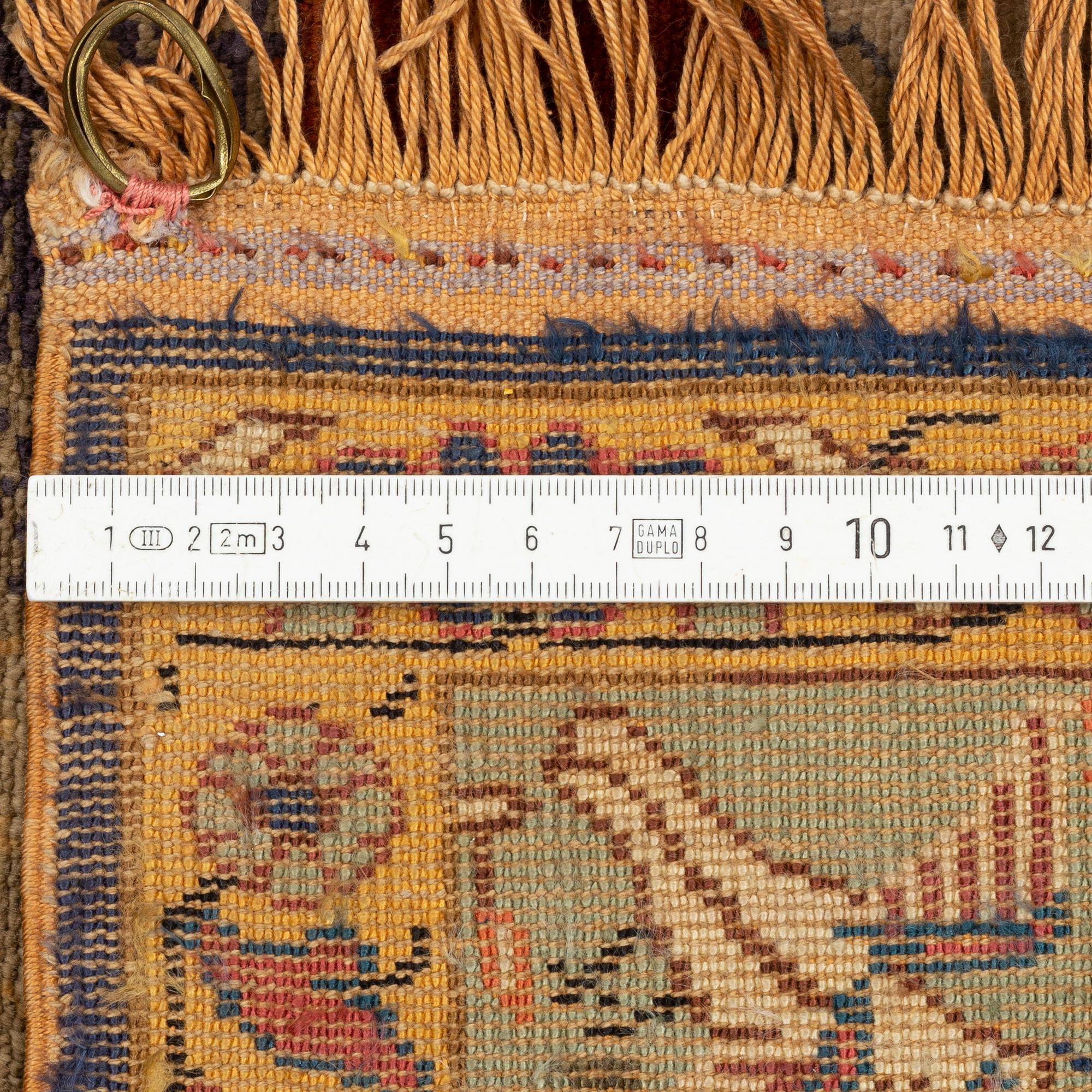 A Turkish rug c. 178 x 122 cm.