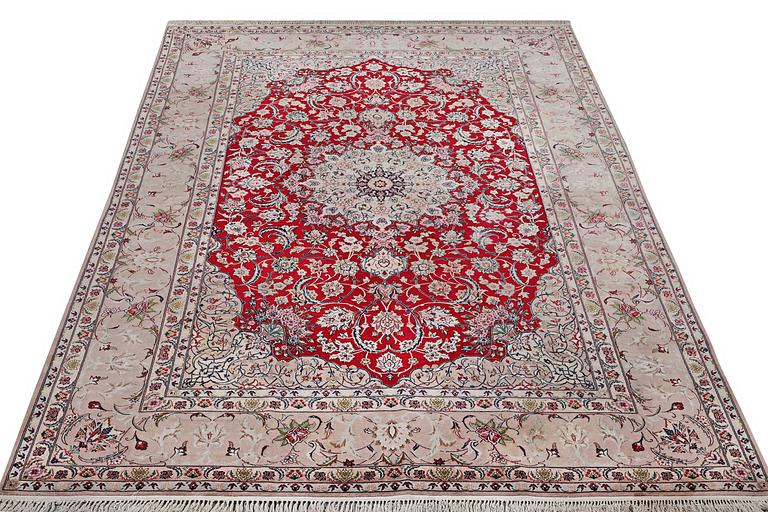 An Esfahan carpet, part silk, signed Rahmi, c. 298 x 206 cm.