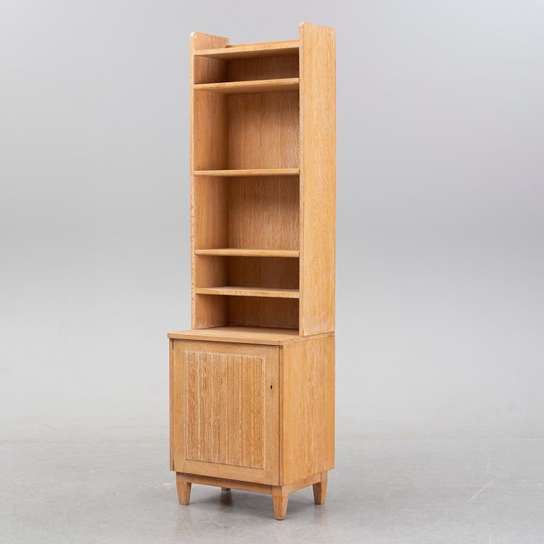 An oak book case with a cabinet, second half of the 20th Century.