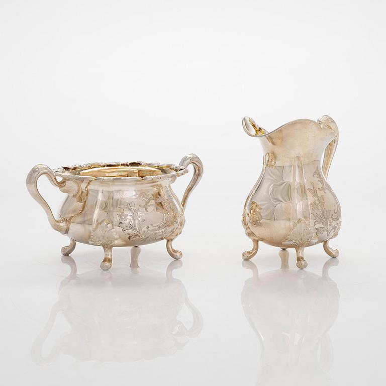 A three-piece silver coffee service and six coasters, Auran Kultaseppä Turku 1965-79.