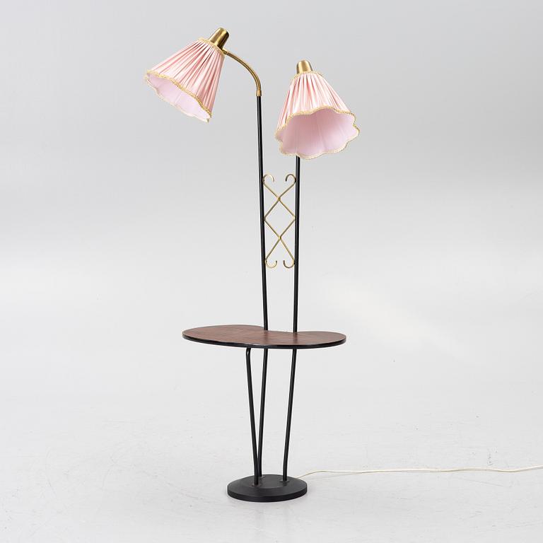 A floor lamp with table, 1940s.