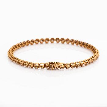 Armband, 18K guld och briljantslipade diamanter.