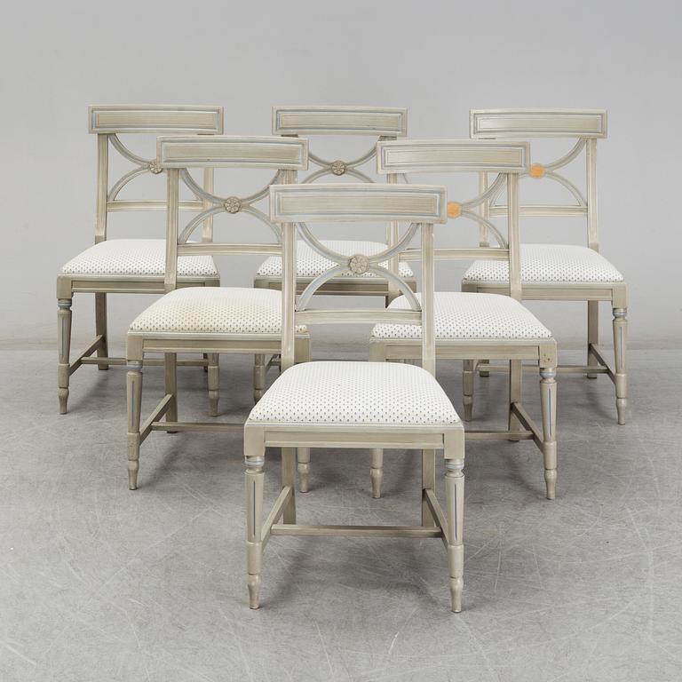 A dining table and six chairs, Gustavian style, second half of the 20th century. One leaf included.
