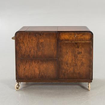 A stained birch bar cabinet from NK dated 1936.