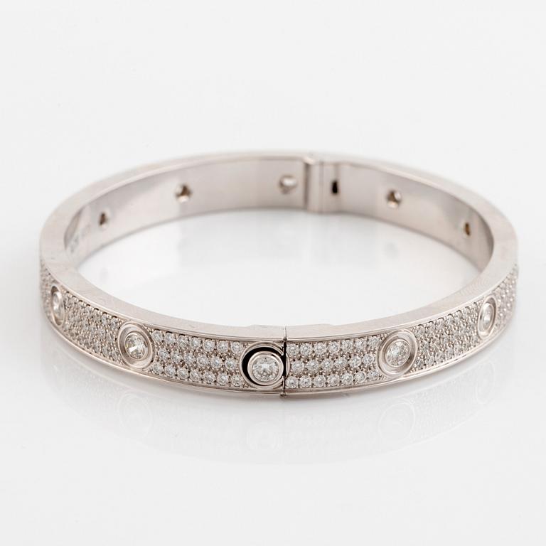 A Cartier "Love" bracelet in 18K white gold set with round brilliant-cut diamonds.